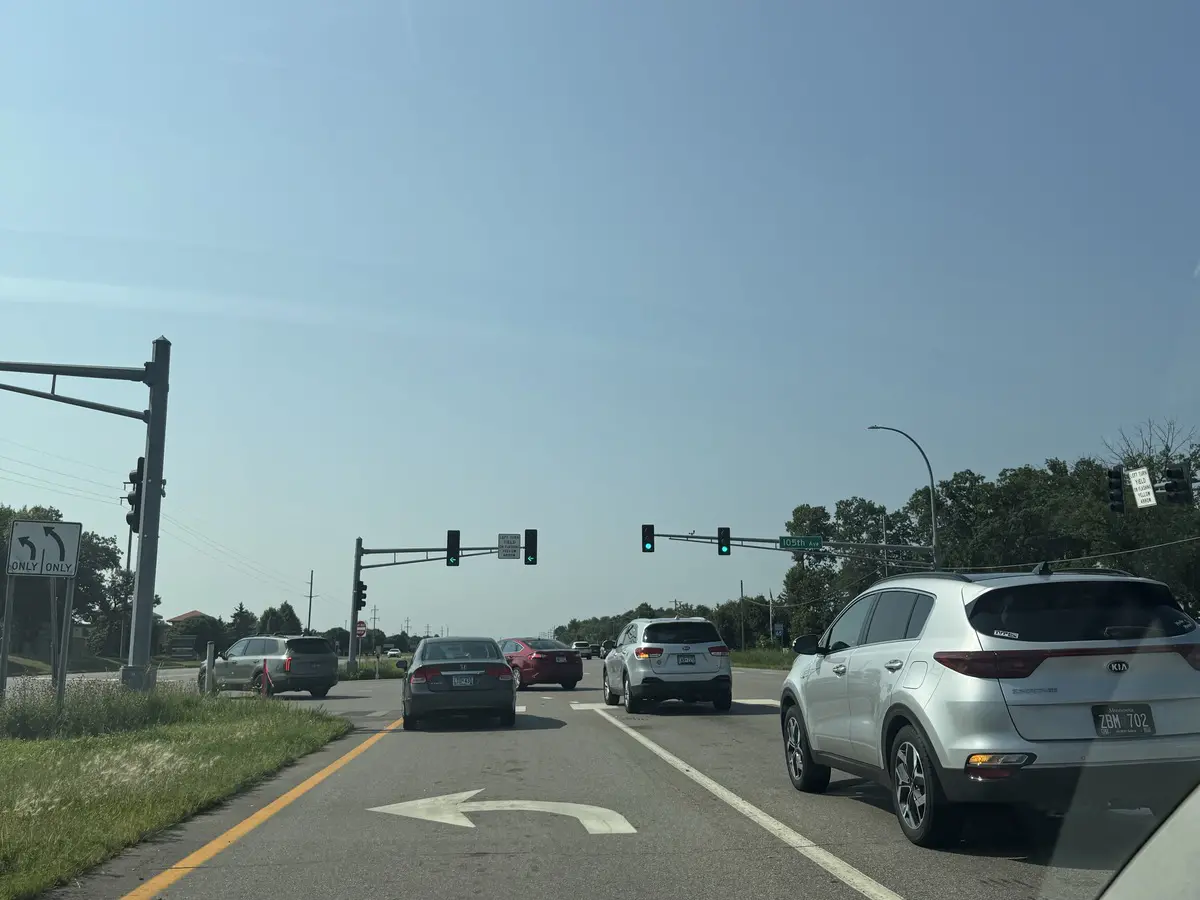 Cars at a Highway 65 intersection in Blaine during a weekday commute