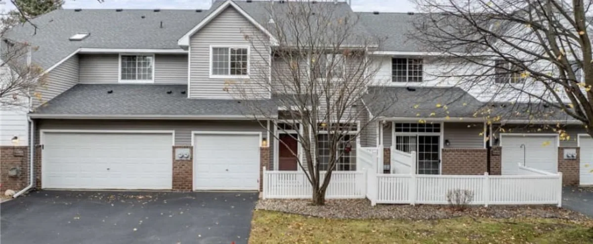 Twin home with two attached garages on a quiet street in Blaine, Minnesota