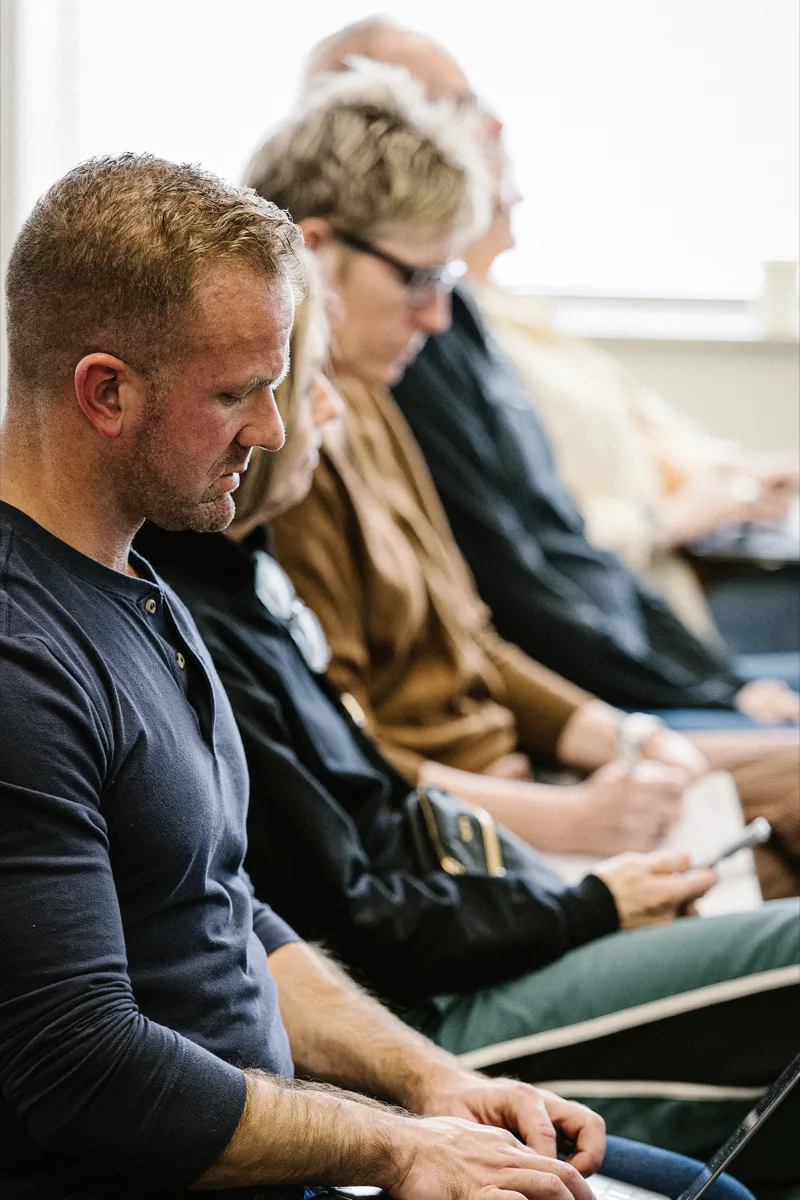 Nick Bock taking notes during a real estate strategy session