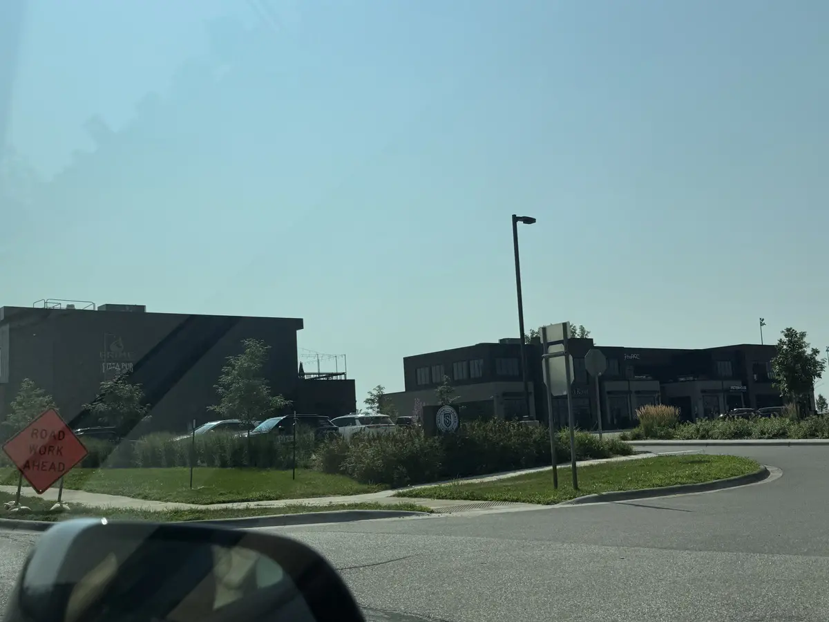 New commercial buildings and a road work sign along the Radisson corridor in Blaine